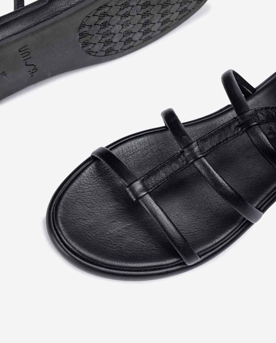 Unisa Mujer Esclava plana en piel - Negro